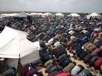 Muslim worshipers perform Friday noon prayers during a tent city protest near the border with Israel east of Jabalia to commemorate Land Day on Mar. 30, 2018. Land Day marks the killing of six Arab Israelis during 1976 demonstrations against Israeli confiscations of Arab land.
(Mohammed ABED / AFP)