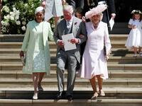 (L-R) Meghan Markle's mother Doria Ragland, Britain's Prince Charles, Prince of Wales (C) and Britain's Camilla, Duchess of Cornwall leave after the wedding ceremony of Britain's Prince Harry, Duke of Sussex and US actress Meghan Markle at St George's Chapel, Windsor Castle, in Windsor, on May 19, 2018. 
Jane Barlow/ AFP