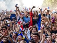 People celebrate on the Place de la Republique (Republic's Square) in Paris on July 15, 2018, after France won the Russia 2018 World Cup final football match between France and Croatia. 
Lucas BARIOULET / AFP
