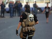 Members of the Iraqi security forces are deployed in the capital Baghdad's Tahrir Square during demonstrations against unemployment on July 16, 2018. (AFP/ Ahmad Al Rubaye)