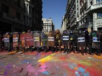 Catalan regional police 'Mossos D'Esquadra' officers, covered in paint, stand guard after clashing with separatist protesters during a counter-protest against a demonstration in support of Spanish police in Barcelona on September 29, 2018. 
Pau Barrena / AFP