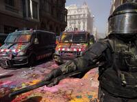 Catalan regional police 'Mossos D'Esquadra' officers, covered in paint, secure the area after clashing with separatist protesters during a counter-protest against a demonstration in support of Spanish police in Barcelona on September 29, 2018. 
Pau Barrena / AFP
