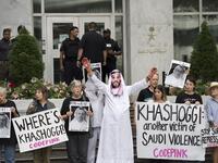 A demonstrator dressed as Saudi Arabian Crown Prince Mohammed bin Salman (C) with blood on his hands protests with others outside the Saudi Embassy in Washington, DC. (Jim WATSON / AFP)