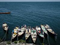 Fishermen prepare their nets aboard their boats on October 5, 2018 on Migingo island which is densely populated by residents fishing mainly for Nile perch in Lake Victoria on the border of Uganda and Kenya.
Yasuyoshi CHIBA / AFP