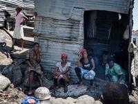 Women gather together on Migingo island on October 5, 2018 which is densely populated by residents fishing mainly for Nile perch in Lake Victoria on the border of Uganda and Kenya. 
Yasuyoshi CHIBA / AFP