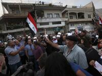 Druze residents of Majdal Shams in the Israeli-annexed Golan Heights set ablaze makeshift ballot papers during a protest. (JALAA MAREY / AFP)