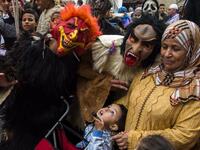 Young Moroccans take part in the Boujloud festival, a popular festival also known as the 'Moroccan Halloween' in the Sidi Moussa district of Sale near Rabat, on October 27, 2018. 
FADEL SENNA / AFP