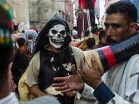 Young Moroccans take part in the Boujloud festival, a popular festival also known as the 'Moroccan Halloween' in the Sidi Moussa district of Sale near Rabat, on October 27, 2018. 
FADEL SENNA / AFP
