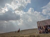 A boy rides a donkey near a new discovery made by an Egyptian archaeological mission. (KHALED DESOUKI / AFP)