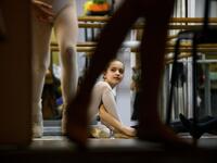 Girls attend a class at a ballet studio in Moscow on November 22, 2018. In a small studio in northern Moscow, parents and grandparents sit in a corridor waiting for children as young as three to finish their ballet class. 
Mladen ANTONOV / AFP