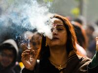 A member of the Indian transgender community smokes a cigarette as she protests against the Transgender Persons (Protection of Rights) Bill.
CHANDAN KHANNA / AFP
