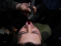 A US Marine drinks snake blood during a jungle survival training with Thai soldiers in the joint 'Cobra Gold' military exercise in Chantaburi province 
Lillian SUWANRUMPHA / AFP