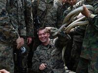 A Thai soldier places snakes to a US Marine during a jungle survival training in the joint 'Cobra Gold' military exercise in Chantaburi province 
Lillian SUWANRUMPHA / AFP