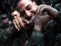 A US Marine eats a gecko during a jungle survival training with Thai soldiers in the joint 'Cobra Gold' military exercise in Chantaburi province
Lillian SUWANRUMPHA / AFP