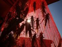 A Kuwaiti vendor holds a bag filled with locusts, sold as food, at a market in Kuwait City 
Yasser Al-Zayyat / AFP