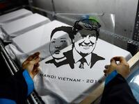 A Vietnamese worker prepares to print T-shirts with portraits of US President Donald Trump and North Korean leader Kim Jong Un at a workshop in Hanoi on February 22, 2019, ahead of the ahead of the second Trump and Kim summit. 
Nhac NGUYEN / AFP