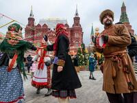 Performers dressed in traditional costumes sing and dance during the Shrovetide spring festival outside the Kremlin in Moscow on March 01, 2019. Mladen ANTONOV / AFP
