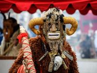 A performer in a scary mask entertains the public during the Shrovetide spring festival outside the Kremlin in Moscow on March 01, 2019. Mladen ANTONOV / AFP