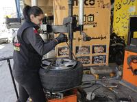 Amina repairs a flat tyre at a car tyre's repair shop in Beirut on March 8, 2019. Amina has been working for 10 years in mechanics, specially in the tyres repair business. She considers it fulfilling as she always dreamt of doing that job.
JOSEPH EID / AFP