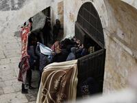 Palestinian protesters break a door of the Golden Gate or Gate of Mercy inside the Al-Aqsa mosques compound in Jerusalem's Old City 
AHMAD GHARABLI / AFP