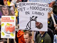 People hold up placards as they attend a march and rally organised by the pro-European People's Vote campaign for a second referendum in central London on March 23, 2019. 
Niklas HALLE'N / AFP