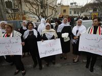 Residents of the Golan Heights raise Syrian and banners during a protest against the backing of Israel's capture of the Golan Heights by the US president, in the village of Majdal Shams in the Israeli-annexed territory on March 23, 2019.
Jalaa MAREY / AFP