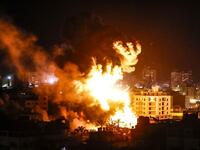 Fire and smoke billow above buildings in Gaza City during reported Israeli strikes on March 25, 2019. Israel's military launched strikes on Hamas targets in the Gaza Strip today, the army and witnesses said, hours after a rocket from the Palestinian enclave hit a house and wounded seven Israelis.
Mahmud Hams / AFP