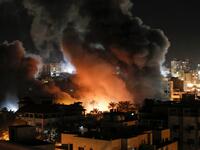 Fire and smoke billow above buildings in Gaza City during reported Israeli strikes on March 25, 2019. Israel's military launched strikes on Hamas targets in the Gaza Strip today, the army and witnesses said, hours after a rocket from the Palestinian enclave hit a house and wounded seven Israelis.
Mahmud Hams / AFP