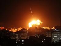 A ball of fire lights the sky above a building believed to house the offices of Hamas chief in Gaza, Ismail Haniyeh, during Israeli strikes on the Gaza City, on March 25, 2019.
Mahmud Hams / AFP