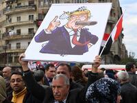 Syrians protest in the northern city of Aleppo against the US decision to recognise Israel's sovereignty over the Golan Heights on March 26, 2019. 
GEORGE OURFALIAN / AFP