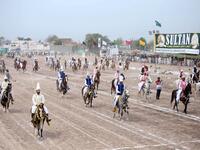 Traditional drumbeats and melodious shahnai are drowned out by thundering hoofs in the small Pakistani city of Tulamba, as riders pound down a dusty track seeking world record glory in the ancient sport of tent-pegging.

SS MIRZA / AFP