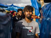 A sub-Saharan migrant walks between make-shift tents in the Oulad Ziane migrant camp in Casablanca on March 27, 2019. 
FADEL SENNA / AFP