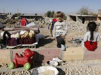 Iranian children next to the rubble of their home in Kouik village near to Sarpol-e Zahab.

(ATTA KENARE / AFP)