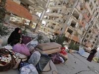Iranians sit outside damaged homes after salvaging furniture and household appliances in the town of Sarpol-e Zahab in the western Kermanshah province near the border with Iraq.

(ATTA KENARE / AFP)