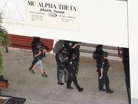 Law enforcement personel work the scene at the Marjory Stoneman Douglas High School after a shooting at the school that reportedly killed and injured multiple people on Feb. 14, 2018 in Parkland, Florida. Numerous law enforcement officials continue to investigate the scene. (Joe Raedle/Getty Images/AFP)