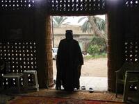 A member of an Iraqi clan enters a straw tent in the town of Mishkhab, south of Najaf on November 15, 2018. 
Haidar HAMDANI / AFP