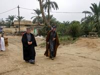 Members of an Iraqi clan gather walk towards a tent in the town of Mishkhab, south of Najaf on November 15, 2018. 
Haidar HAMDANI / AFP