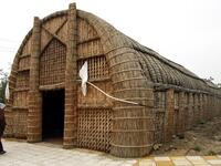 A member of an Iraqi clan enters a straw tent in the town of Mishkhab, south of Najaf on November 15, 2018. 
Haidar HAMDANI / AFP