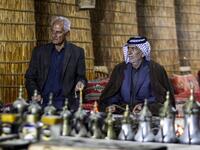 Members of an Iraqi clan gather inside a straw tent in the town of Mishkhab, south of Najaf on November 15, 2018. 
Haidar HAMDANI / AFP
