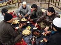  Pakistani customers eat grilled meat at the Charsi (Hashish) Tikka restaurant in Namak Mandi in Peshawar.
ABDUL MAJEED / AFP