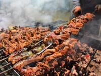 Pakistani man cooks grilled meat at the Charsi (Hashish) Tikka restaurant in Namak Mandi in Peshawar.
ABDUL MAJEED / AFP