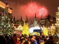 People look at fireworks exploding over the Kremlin in Moscow during New Year celebrations, on January 1, 2019. 
Mladen ANTONOV / AFP