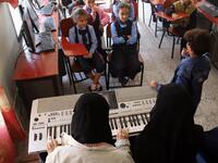 Children attend a music class at the Al-Nawras school in Taez, Yemen's third city, in the country's southwest
AHMAD AL-BASHA / AFP