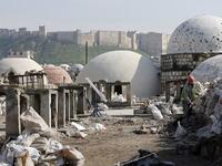Labourers take part in restoration work at the Saqatiya market in the old quarter of Syria's second city of Aleppo 
LOUAI BESHARA / AFP