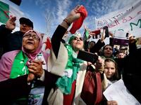 Protesters hold Algerian national flags during a sit-in against the Algerian president's bid for a fifth term in office
GERARD JULIEN / AFP