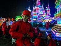 Traditional dancers wait to perform during abbot Kay Lar Tha's funeral procession in Mudon, Mon State. 
Ye Aung THU / AFP