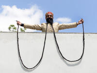Ram Singh Chauhan (61) displays his 18ft moustache in Ahmedabad, India. It has been recognized by the Guinness Book of World Records as the world's longest moustache. (AFP/ File Photo)