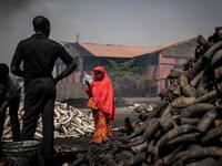 A girl stands in front of cow horns at Kaduna Abatour meat market in North Kaduna CRISTINA ALDEHUELA / AFP