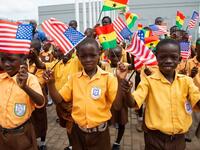 Children wave the American and Ghana flags for US First Lady Melania Trump during an arrival ceremony after landing at Kotoka International Airport in Accra October 2, 2018 as she begins her week long trip to Africa to promote her 'Be Best' campaign. (SAUL LOEB / AFP)

