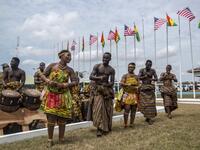 Musicians and dancers wait for the arrival of the US first lady at Kotoka International Airport in Accra on October 2, 2018. (CRISTINA ALDEHUELA / AFP)